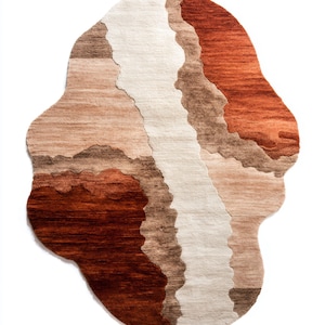 An irregular-shaped rug with wavy sections of dark brown, light brown, beige, and terracotta colors.