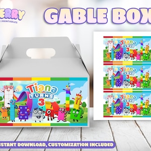 Könnte beinhalten: Eine weiße Gable-Box mit einem farbenfrohen Design für eine Geburtstagsfeier. Die Box zeigt den Text "Tiana Turns 3" mit Zeichentrickfiguren und einem Regenbogen. Die Worte "GABLE BOX" stehen oben. Auf der rechten Seite befindet sich ein Bogen mit passenden Etiketten.