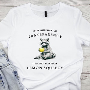 In the Interest of Full Transparency, It Wasn&#39;t Easy Peasy Lemon Squeezy Tee with Raccoon and Lemon, Funny Graphic Shirt, Unisex Cotton Tee