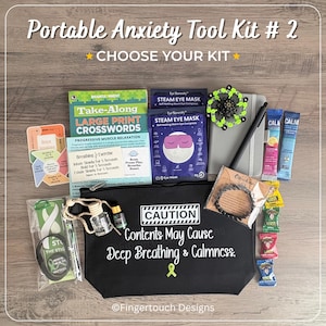 May include: A black zippered pouch with the text CAUTION Contents May Cause Deep Breathing & Calmness. The kit includes a crossword book, steam eye masks, a notebook, a pen, a fidget toy, essential oil, a bracelet, drink mix sticks, and candies.