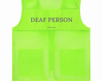 May include: A neon green mesh vest with the words "DEAF PERSON" printed in gray across the upper back. The word "seemee" is printed below the text. The vest has a sleeveless design and a round neckline.