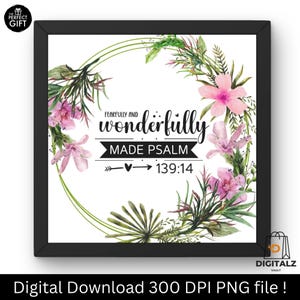 Puede incluir: Impresión enmarcada con fondo blanco, con una corona floral con flores rosas y hojas verdes. El texto dice "Fearfully and wonderfully made Psalm 139:14". El marco es negro.
