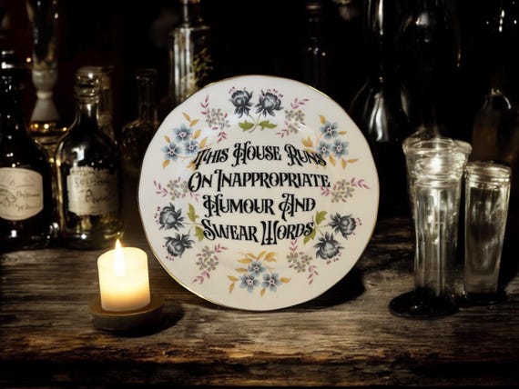 This house runs on inappropriate humor and swear words, vintage plate with stand