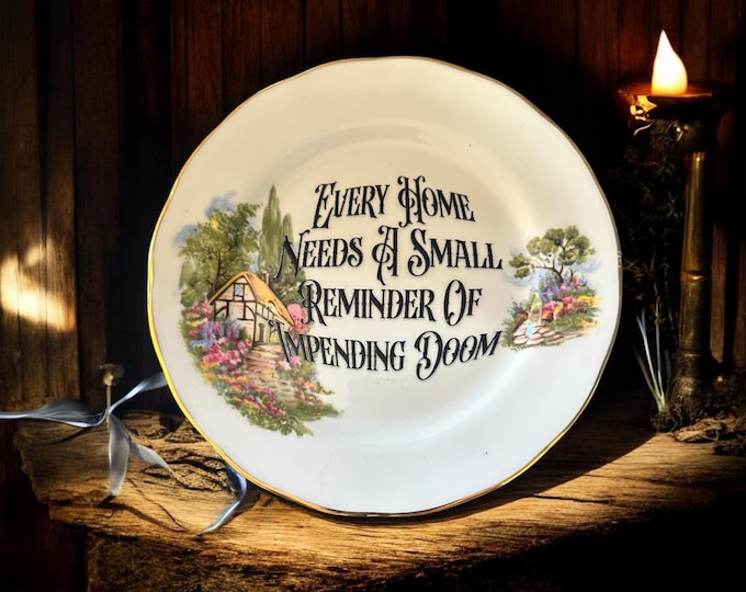 Every home needs a small reminder of impending doom, vintage plate with stand