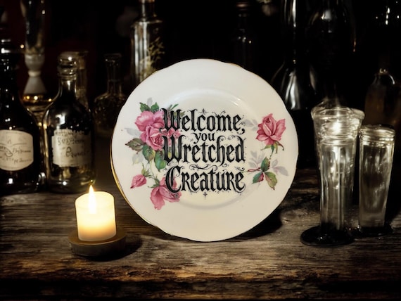 Welcome wretched creature, vintage plate with stand