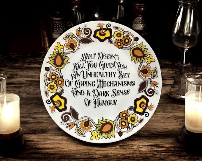 What doesn't kill you gives you an unhealthy set of coping mechanisms and a dark sense of humour, vintage plate with stand