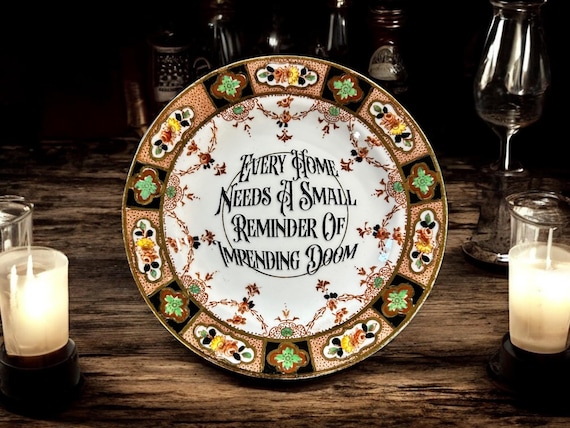 Every home needs a small reminder of impending doom, vintage plate with stand