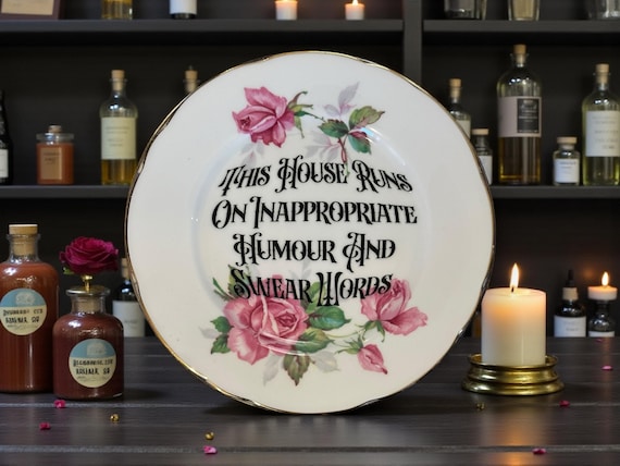 This house runs on inappropriate humor and swear words, vintage plate with stand