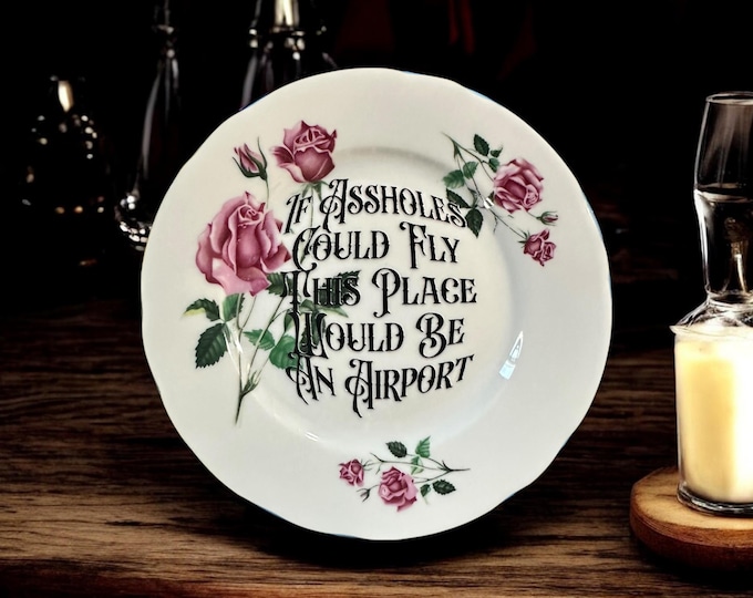 If assholes could fly this place would be an airport, vintage plate with stand