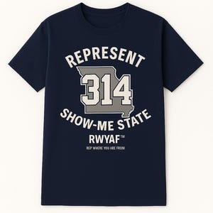 May include: Navy blue t-shirt with white and gray text. The text reads "REPRESENT 314 SHOW-ME STATE" with "RWYAF" and "REP WHERE YOU ARE FROM" below. The graphic includes a stylized outline of Missouri.