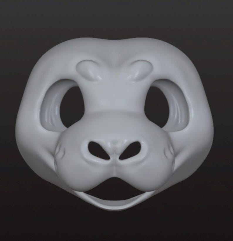 May include: A light gray, smooth, sculpted animal mask base featuring large, rounded eye sockets, a prominent snout with two nostril openings, and an open mouth area. The mask has a rounded, symmetrical shape with defined brow ridges.