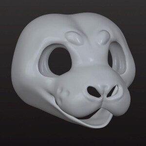 May include: A light gray, smooth, three-dimensional animal mask base featuring large, hollow eye sockets, a prominent snout with two nostril openings, and a wide, open mouth area. The surface is matte and uniform, showing a sculpted, rounded head shape.