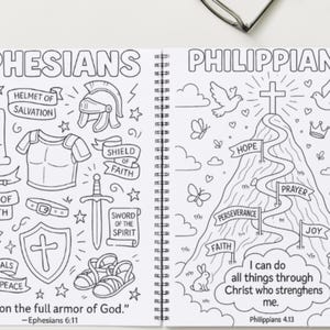 May include: A colouring book open at two pages with black and white drawings. One page shows the word "Ephesians" and armour elements. The other page has "Philippians" with a mountain and inspirational words.