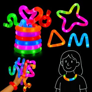 Puede incluir: Una colección de Pop Tubes brillantes y coloridos en varias formas, incluyendo un corazón, una estrella, un triángulo y la letra M. También se muestra una pila de Pop Tubes. Una mano sostiene un Pop Tube, y un dibujo de una persona con un collar de Pop Tubes.