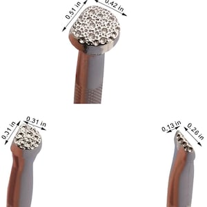 May include: Close-up of three silver-colored metal tools with textured, rounded heads. The largest head measures 0.51 x 0.42 inches. The tools have gray handles and are likely used for crafting or jewelry making.