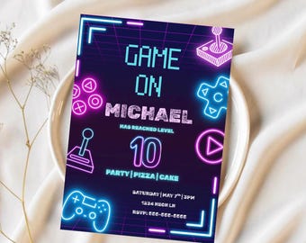 May include: A neon-themed birthday party invitation with the text "GAME ON MICHAEL HAS REACHED LEVEL 10". The invitation features game controller icons in pink and blue, with the party details at the bottom.