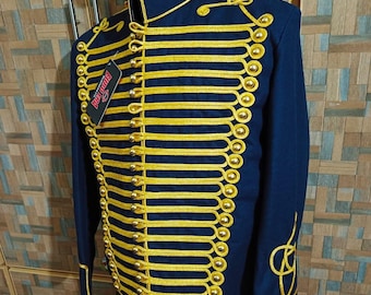 May include: Navy blue military-style jacket with gold-colored trim and buttons. The jacket features a high collar and decorative gold embroidery on the sleeves. A tag is attached to the jacket. The jacket is displayed on a black mannequin.