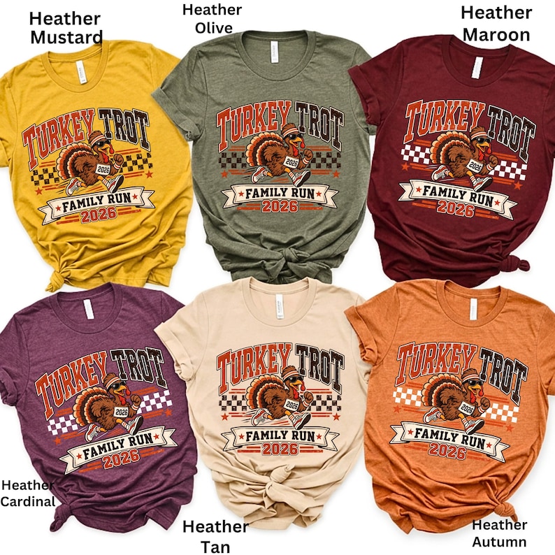 May include: Six short-sleeved t-shirts in heather mustard, heather olive, heather maroon, heather cardinal, heather tan, and heather autumn. Each shirt features a graphic of a running turkey wearing a hat and sneakers, with the text Turkey Trot Family Run 2026.
