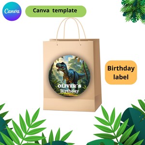 May include: A tan paper gift bag with a round dinosaur-themed label. The label features a blue and green dinosaur in a jungle setting with the text "OLIVER'S Birthday". The bag has a "Birthday label" and "Canva template" text.
