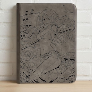May include: Grey tablet case with a detailed illustration of an anime character in a bikini, holding a staff, with a pirate ship and treasure chest. The case is made of a smooth, leather-like material.