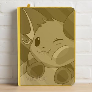 Può includere: Un raccoglitore giallo con un personaggio dei cartoni animati nei toni del marrone. Il personaggio fa l'occhiolino e ha grandi orecchie. Il raccoglitore ha un dorso giallo e la parola "Vaultx" è visibile in basso a sinistra.