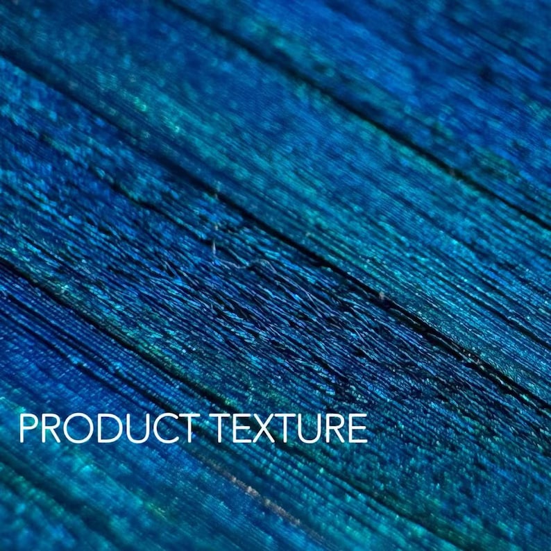 May include: A close-up shot of a textured surface with a gradient of blue and teal colours. The image shows diagonal lines and the text "PRODUCT TEXTURE" in white.