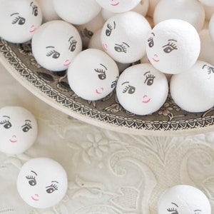 Spun Cotton Heads: CHARM 30mm Vintage-Style Cotton Doll Heads with Faces, 12 Pcs. image 1