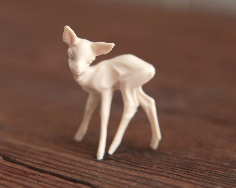 small plastic deer figurines