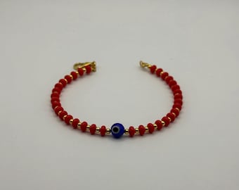 Handmade Red and gold beaded Evil Eye bracelet