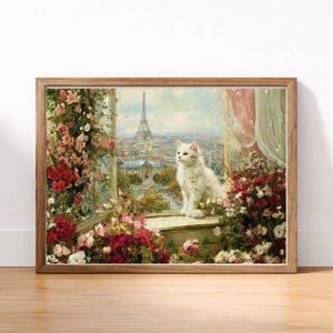 May include: A framed art print featuring a white cat perched on a window ledge overlooking Paris. The artwork showcases the Eiffel Tower and cityscape, surrounded by vibrant flowers in shades of red, pink, and white. The frame is a warm, natural wood tone.