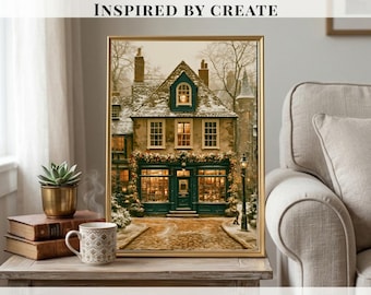 May include: A framed wall art print depicting a two-story building with a dark green storefront, snow-covered roof, and warm glowing windows. The scene includes a cobblestone path and a street lamp. The text INSPIRED BY CREATE is visible.
