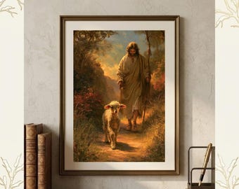 May include: A framed wall art print titled INSPIRED BY CREATE featuring a painting of a figure in a tan robe walking with a staff alongside a small white lamb on a dirt path. The scene is set in a warm, golden-toned landscape with trees.