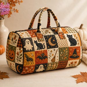 May include: A quilted duffel bag featuring a patchwork pattern of Halloween-themed illustrations including ghosts, black cats, pumpkins, crescent moons, bats, witch hats, and brooms in shades of orange, black, cream, and green with two handles.