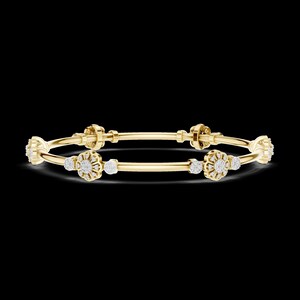 May include: Two gold bangles with floral and diamond accents. The bangles have a polished finish and are set against a black background. Each bangle features multiple diamond clusters and floral designs.