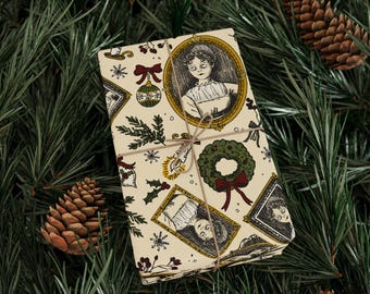 May include: Wrapped gift with a cream-colored paper featuring a repeating pattern of vintage portraits, Christmas ornaments, wreaths, and botanical elements. The gift is tied with twine and set against a backdrop of pine needles and pine cones.
