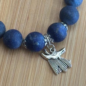 Matte Lapis Lazuli Anubis charm bracelet, 12mm beaded gemstone elastic bracelet, approx. 7.5 inches.