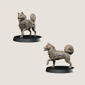 May include: Two grey dog figurines, each on a black circular base. The dogs have detailed fur, open mouths, and wear tactical vests with pouches. One dog is mid-stride, the other is standing.