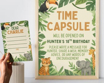 Könnte beinhalten: Ein gerahmtes "Time Capsule"-Schild mit Dschungel-Illustrationen, darunter ein Tukan, ein Tiger, ein Elefant und eine Giraffe. Auf dem Schild steht "Wird am 18. Geburtstag von Hunter geöffnet". Eine passende Karte ist ebenfalls zu sehen.