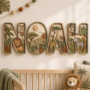 May include: A multi-layered wooden wall art set spelling the name NOAH. Each letter and the central oval frame feature intricate jungle scenes with a lion, monkey, elephant, giraffe, and zebra, rendered in shades of green, brown, and tan.