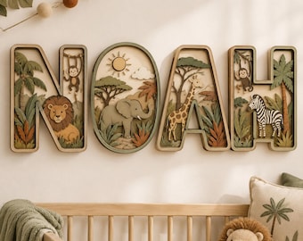 May include: A multi-layered wooden wall art set spelling the name NOAH. Each letter and the central oval frame feature intricate jungle scenes with a lion, monkey, elephant, giraffe, and zebra, rendered in shades of green, brown, and tan.