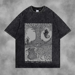May include: Dark grey t-shirt featuring a black and white illustration of a rabbit, tree, and a creature. The text "WILL YOU JOIN MY OWNSELF?" is included in the design.