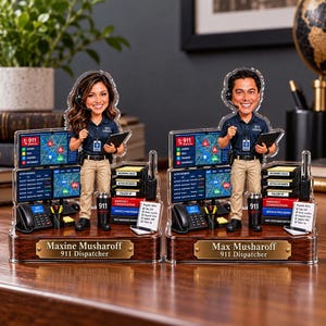 May include: Two custom acrylic desk ornaments featuring 911 dispatchers. One displays the name Maxine Musharoff and the other Max Musharoff. Each includes a miniature workstation with computer screens, a telephone, and a 911 tumbler.