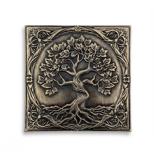 May include: Square bronze-colored wall art featuring a detailed relief of a tree with roots, trunk, and leafy branches. The tree is centered within a circular frame, surrounded by an ornate floral border. The artwork has a vintage, antique aesthetic.