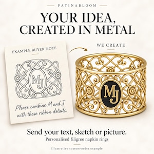 May include: A gold-toned metal napkin ring featuring an intricate filigree pattern with a central black oval plaque displaying the gold letters MJ. Beside it, a note reads: EXAMPLE BUYER NOTE, Please combine M and J with these ribbon details.
