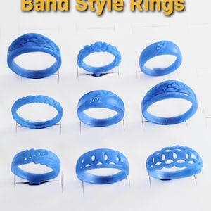 May include: Nine blue wax ring models arranged in a grid, each featuring distinct decorative patterns such as floral, braided, and geometric cutouts. The text "Band Style Rings" is displayed in yellow at the top of the image.