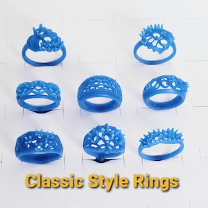 May include: A collection of blue wax ring models in various floral and abstract designs. The rings are arranged on a white surface, with the text "Classic Style Rings" in a yellow and brown font at the bottom.