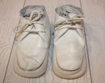 Vintage white leather baby shoes pair of baby shoes prop for display cute little shoes child clothing worn shabby baby shoes