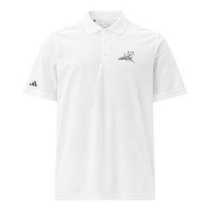 May include: A white short-sleeve polo shirt featuring a three-button placket and a collar. On the left chest, there is a small graphic of an F-14 Tomcat fighter jet with the text F-14 TOMCAT. A black Adidas logo is visible on the right sleeve.