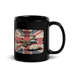 May include: Black ceramic mug featuring a vintage illustration of an Avro Lancaster bomber plane against a distressed Union Jack flag background. The mug has the text "AVRO Lancaster" in a stylized font.