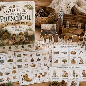 May include: A Little House Pioneer Preschool Extension Pack binder featuring illustrations of children in a pioneer setting. Includes alphabet cards, sorting mats, chore action cards, and paper cutouts of a covered wagon, horse, and pioneer figures.